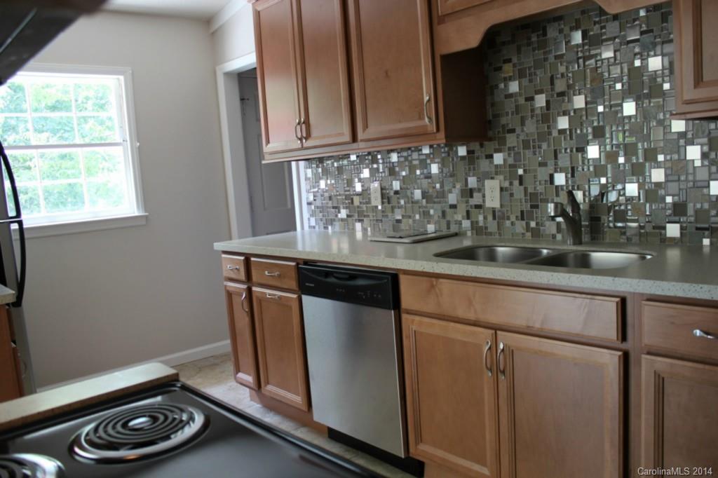 3590 Lake Shore Road South Denver, NC 28037 - Photo 11 of 18 a kitchen with a sink and cabinets