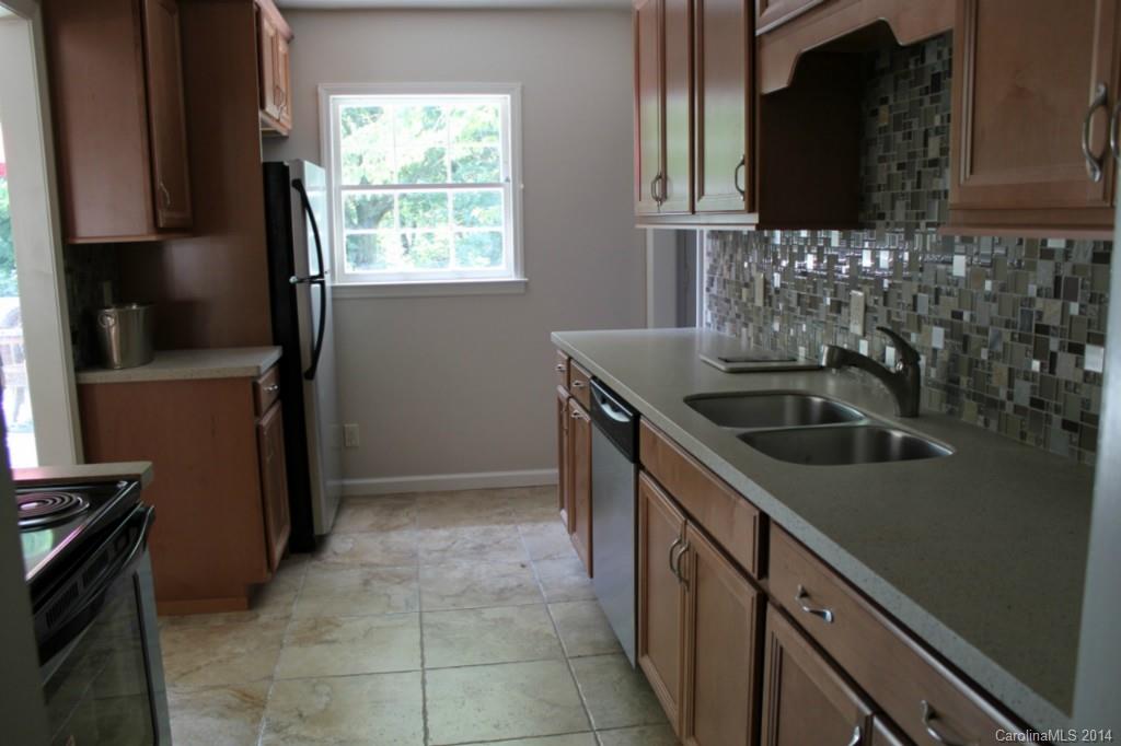 3590 Lake Shore Road South Denver, NC 28037 - Photo 12 of 18 a kitchen that has a sink and a stove