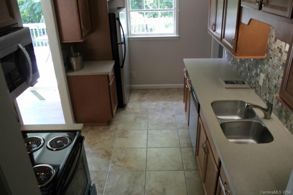 3590 Lake Shore Road South Denver, NC 28037 - Photo 13 of 18 a kitchen with a sink and a stove top oven