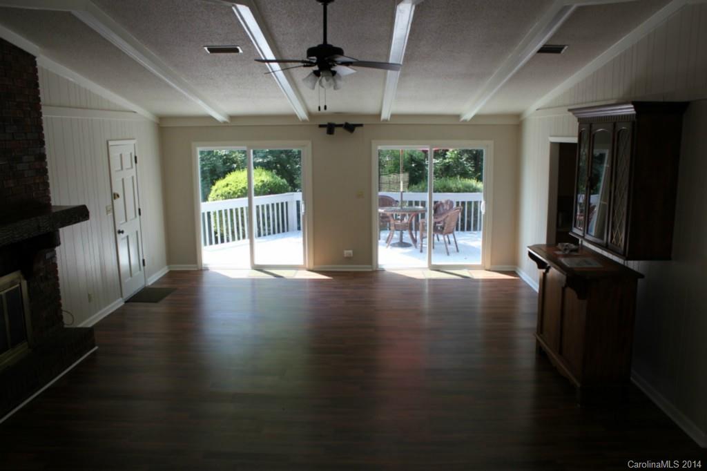 3590 Lake Shore Road South Denver, NC 28037 - Photo 15 of 18 a view of a livingroom with wooden floor and a ceiling fan