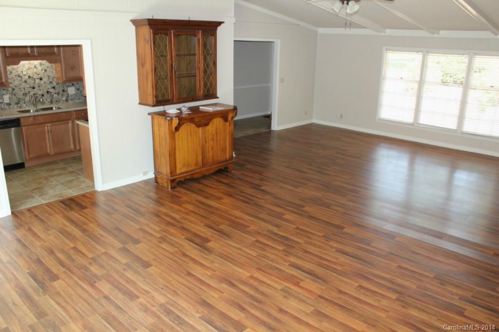3590 Lake Shore Road South Denver, NC 28037 - Photo 16 of 18 an empty room with wooden floor and windows
