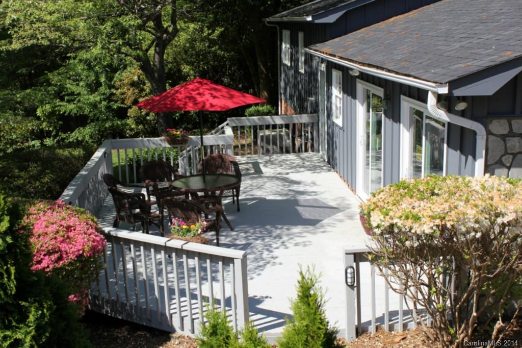 3590 Lake Shore Road South Denver, NC 28037 - Photo 3 of 18 a view of a patio with a table and chairs under an umbrella