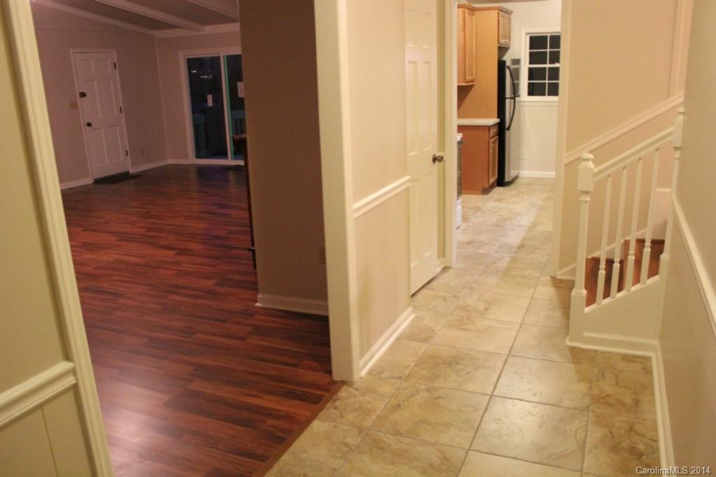 3590 Lake Shore Road South Denver, NC 28037 - Photo 9 of 18 a view of a hallway with wooden floor and staircase