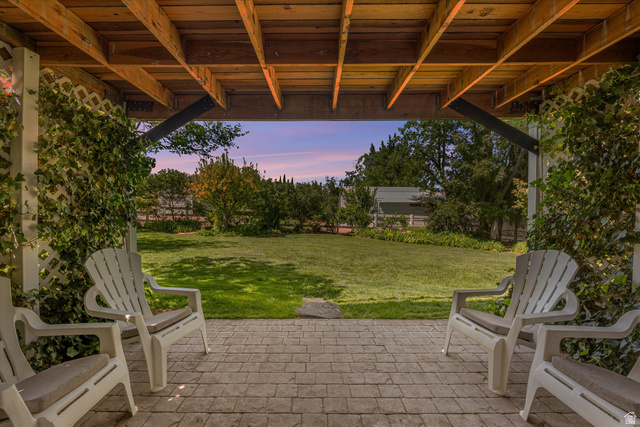 246 West Mount Charm Road Toquerville, UT 84774 - Photo 52 of 70 Patio terrace at dusk with a yard and a patio area