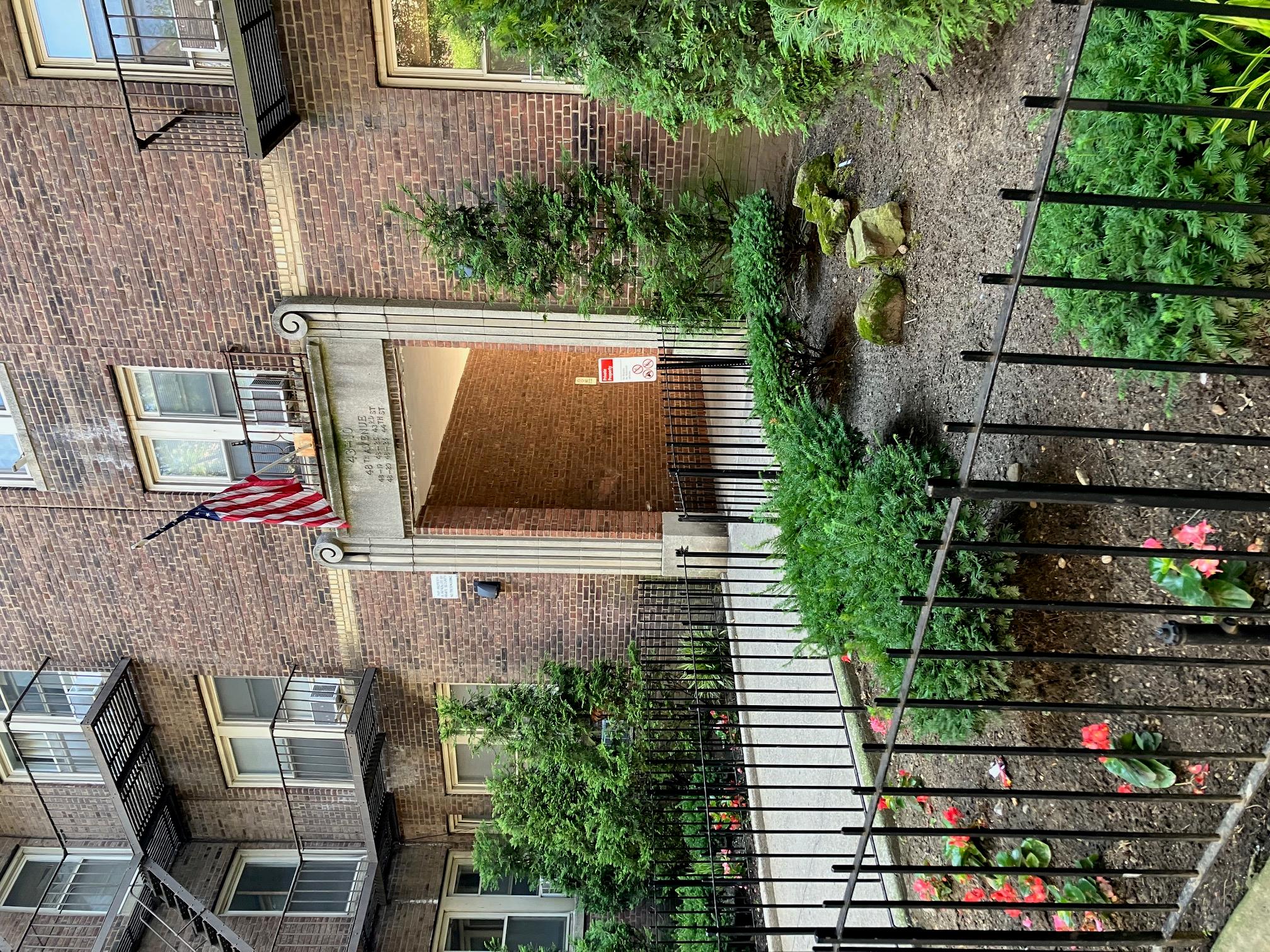 48-55 43rd Street, Unit 2F Queens, NY 11377 - Photo 13 of 13 a house view with a garden space