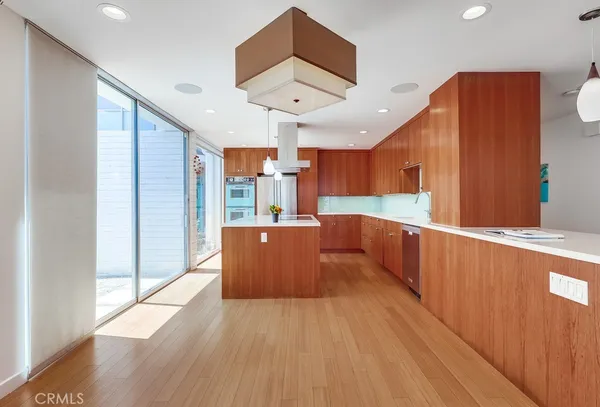 a kitchen with wooden cabinets and sink