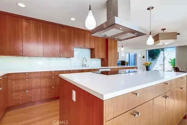 a view of a patio with table and chairs and potted plants