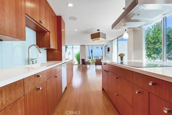 a bedroom with a bed painting on wall and a large window