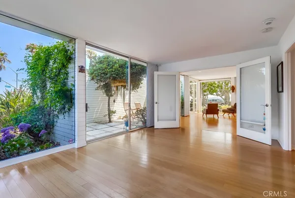 a bedroom with a large bed and a large window