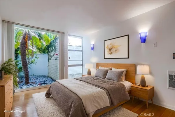 a view of room with furniture and wooden floor