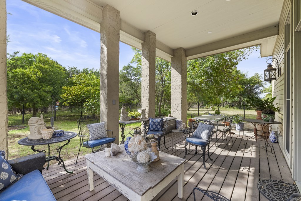 3965 Highway 27 Kerrville, TX 78028 - Photo 15 of 62 a living room with patio furniture and a floor to ceiling window