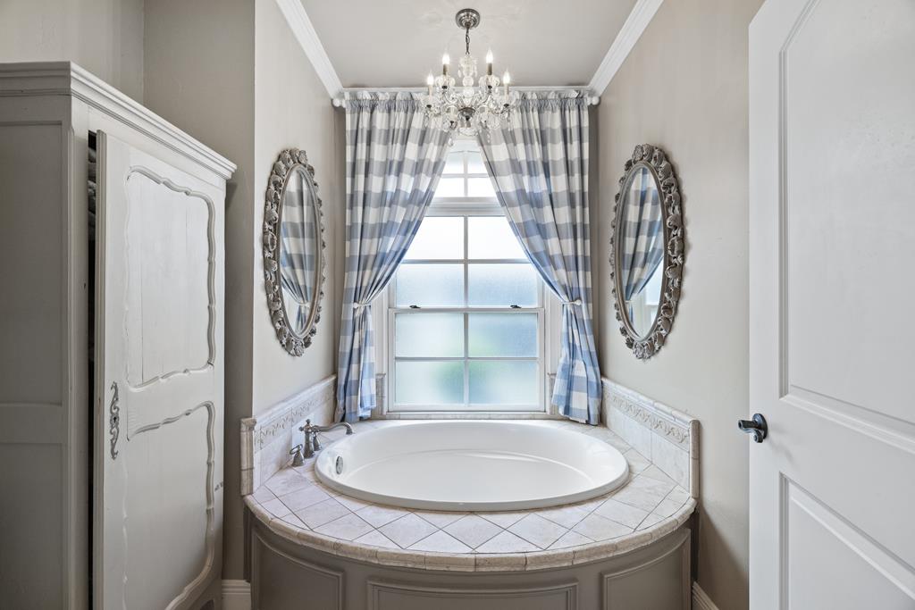 3965 Highway 27 Kerrville, TX 78028 - Photo 24 of 62 a bathroom with a sink a mirror and a toilet