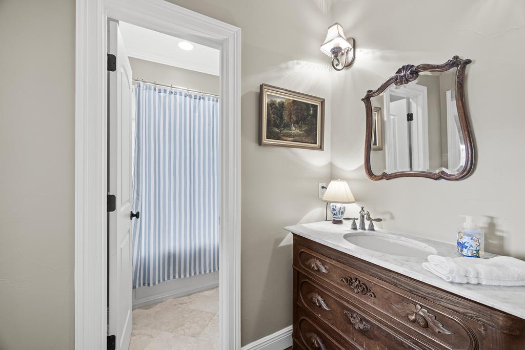 3965 Highway 27 Kerrville, TX 78028 - Photo 35 of 62 a bathroom with a sink and a mirror