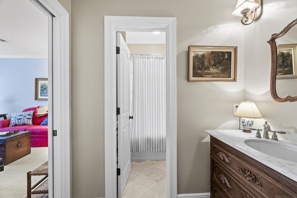 3965 Highway 27 Kerrville, TX 78028 - Photo 36 of 62 a en suite bathroom with a sink and a mirror