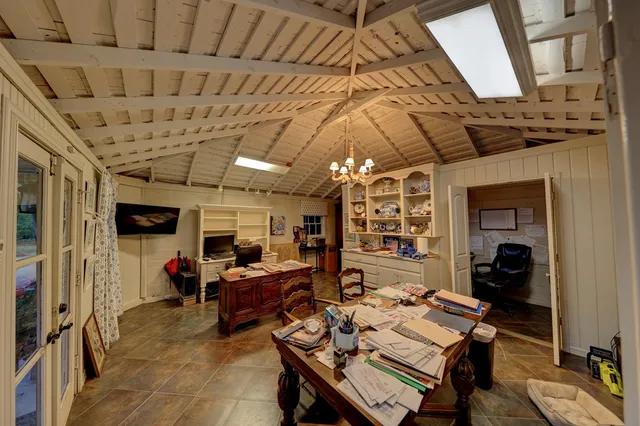 a bedroom with furniture and wooden floor