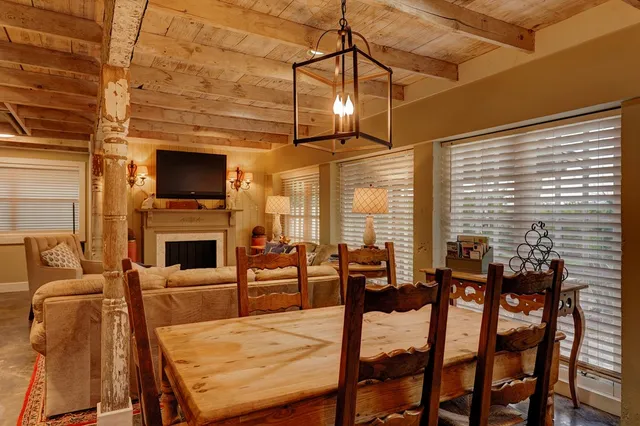 a living room with furniture lots of tables and chairs