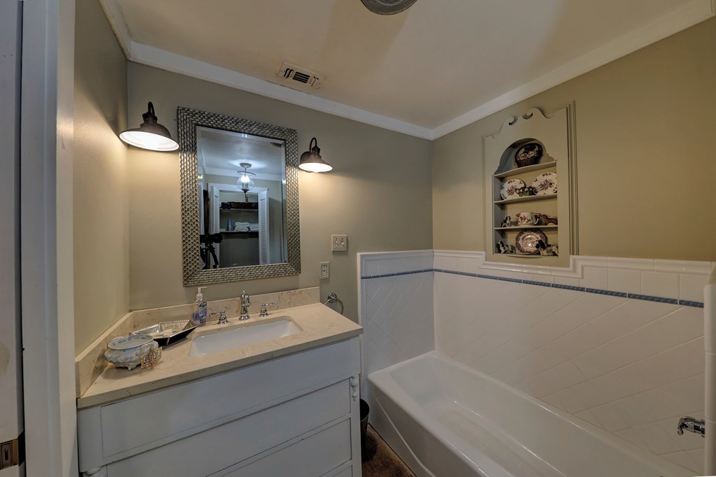 3965 Highway 27 Kerrville, TX 78028 - Photo 46 of 62 a bathroom with a sink and a mirror