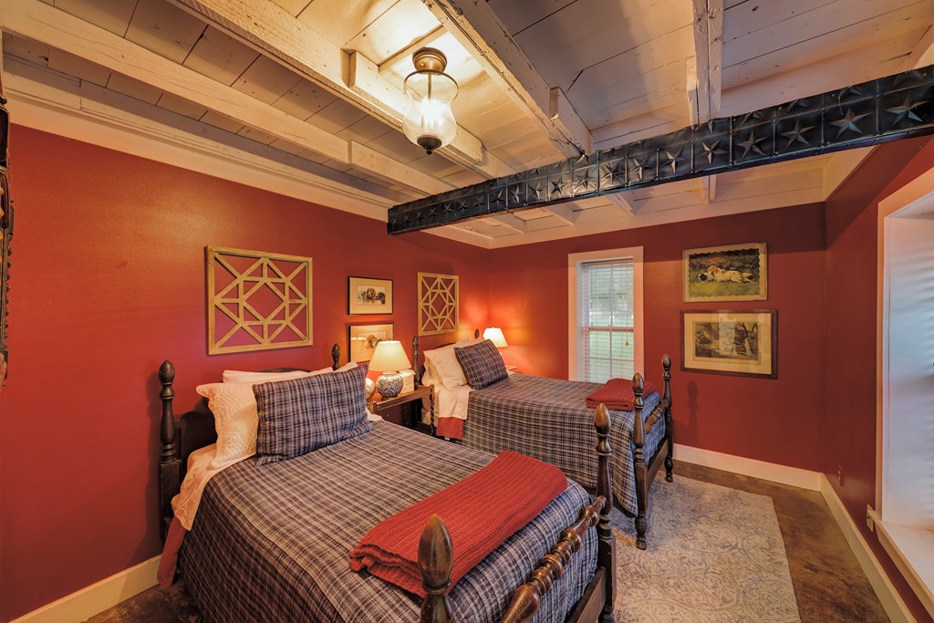 3965 Highway 27 Kerrville, TX 78028 - Photo 47 of 62 a bedroom with furniture and wooden floor