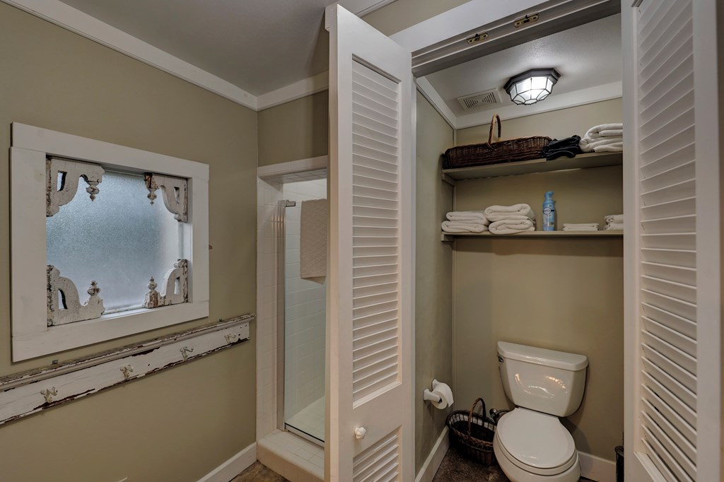 3965 Highway 27 Kerrville, TX 78028 - Photo 48 of 62 a bathroom with a toilet sink and mirror