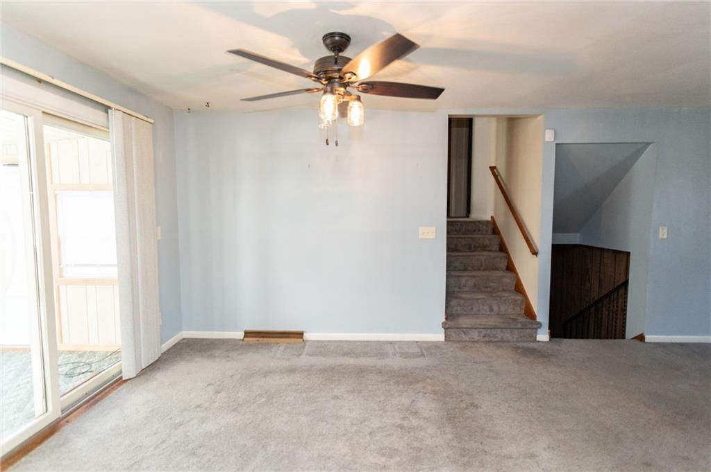 117 Cemetery Road Vanderbilt, PA 15486 - Photo 14 of 25 an empty room with windows and fan