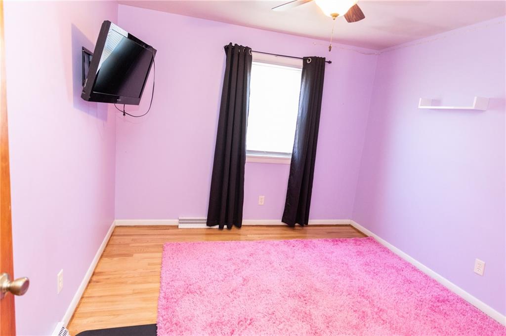 117 Cemetery Road Vanderbilt, PA 15486 - Photo 19 of 25 a view of a room with wooden floor and mirror