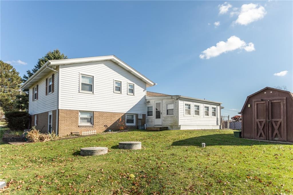 117 Cemetery Road Vanderbilt, PA 15486 - Photo 2 of 25 a front view of a house with garden