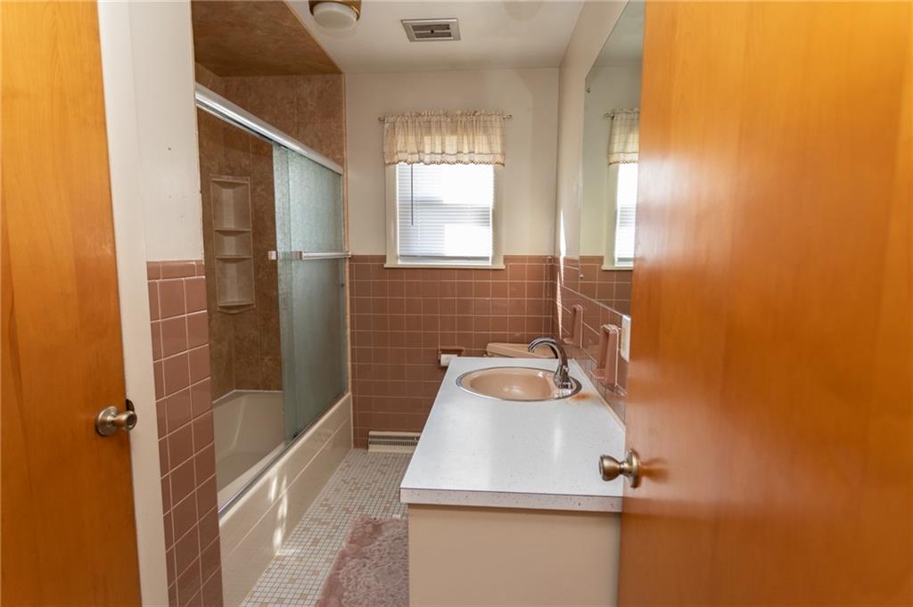 117 Cemetery Road Vanderbilt, PA 15486 - Photo 22 of 25 a bathroom with a sink a toilet and shower