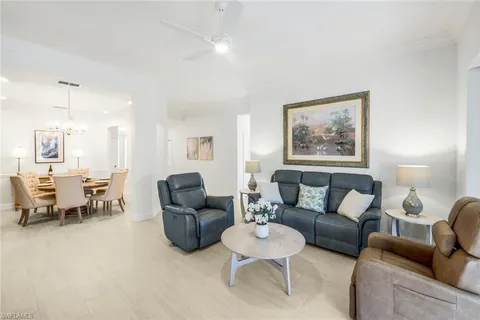 a spacious bedroom with a bed and a couch