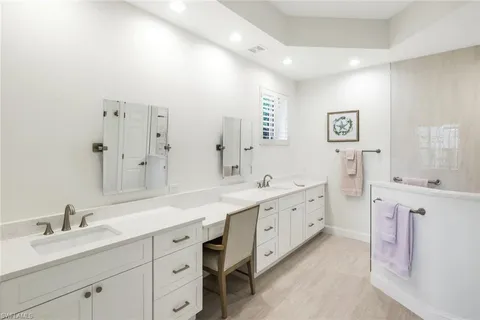 a bathroom with a tub sink and shower