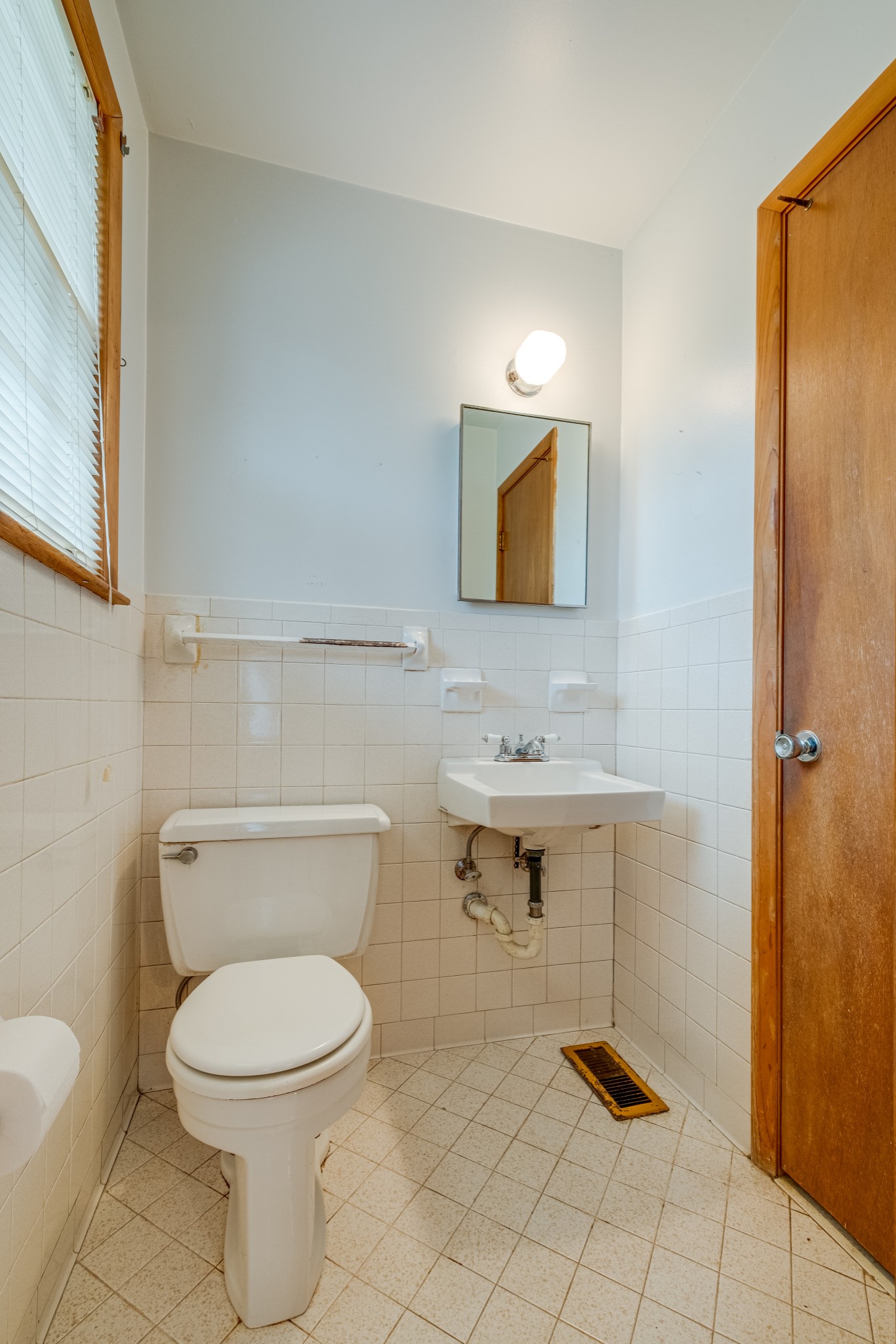 78 Tusculum Road Antioch, TN 37013 - Photo 18 of 27 a bathroom with a toilet a sink and mirror