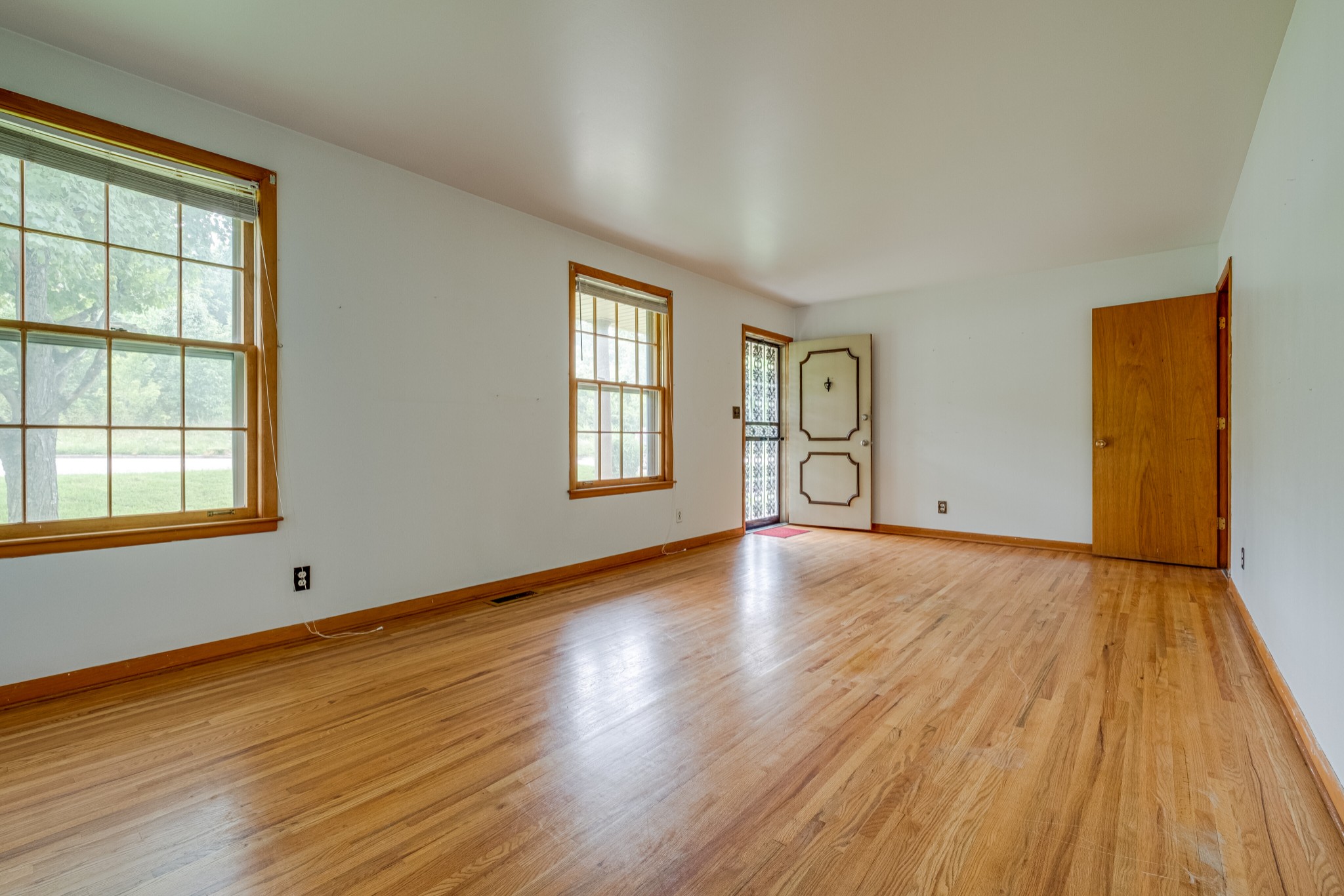 78 Tusculum Road Antioch, TN 37013 - Photo 6 of 27 a view of an empty room with window and wooden floor