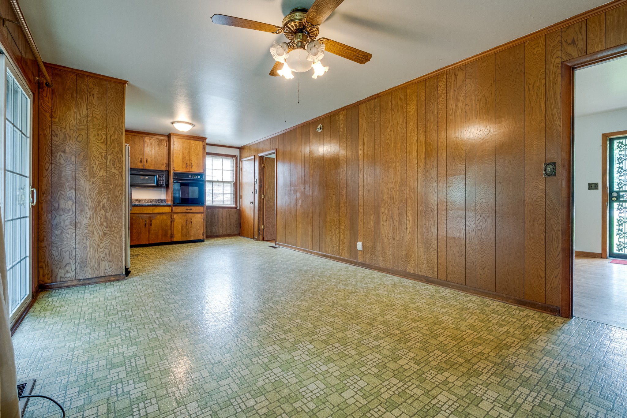 78 Tusculum Road Antioch, TN 37013 - Photo 10 of 27 a view of a kitchen with a sink and dishwasher a refrigerator with wooden floor