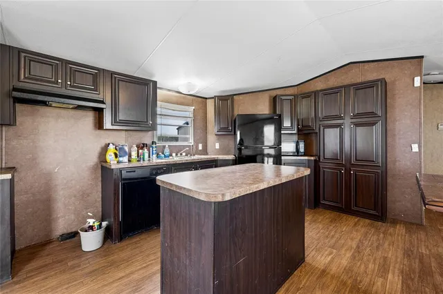 a bathroom with a granite countertop sink shower and a mirror