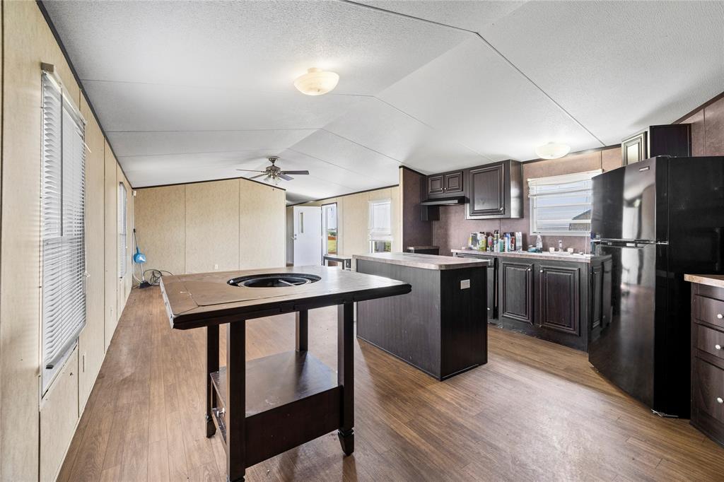 3607 Hackett Branch Road Midway, TX 75852 - Photo 16 of 21 a kitchen with stainless steel appliances granite countertop a refrigerator a sink and a stove