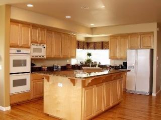 3764 Skyfarm Drive Santa Rosa, CA 95403 - Photo 3 of 6 a kitchen with stainless steel appliances granite countertop a stove a refrigerator a sink and dishwasher with wooden floor