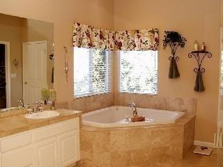 3764 Skyfarm Drive Santa Rosa, CA 95403 - Photo 4 of 6 a bathroom with a tub sink and mirror