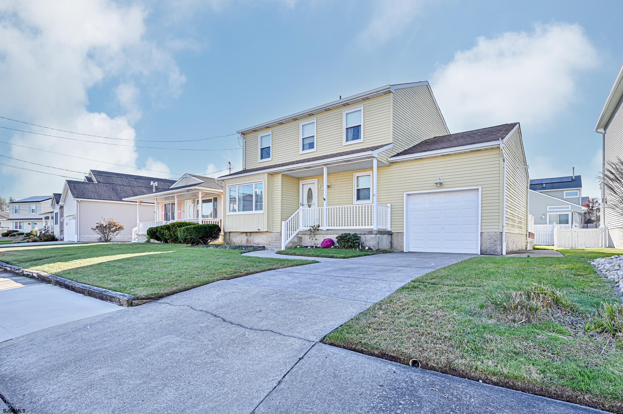 16 MacDermott Place Brigantine, NJ 08203 - Photo 1 of 37 a front view of a house with garden