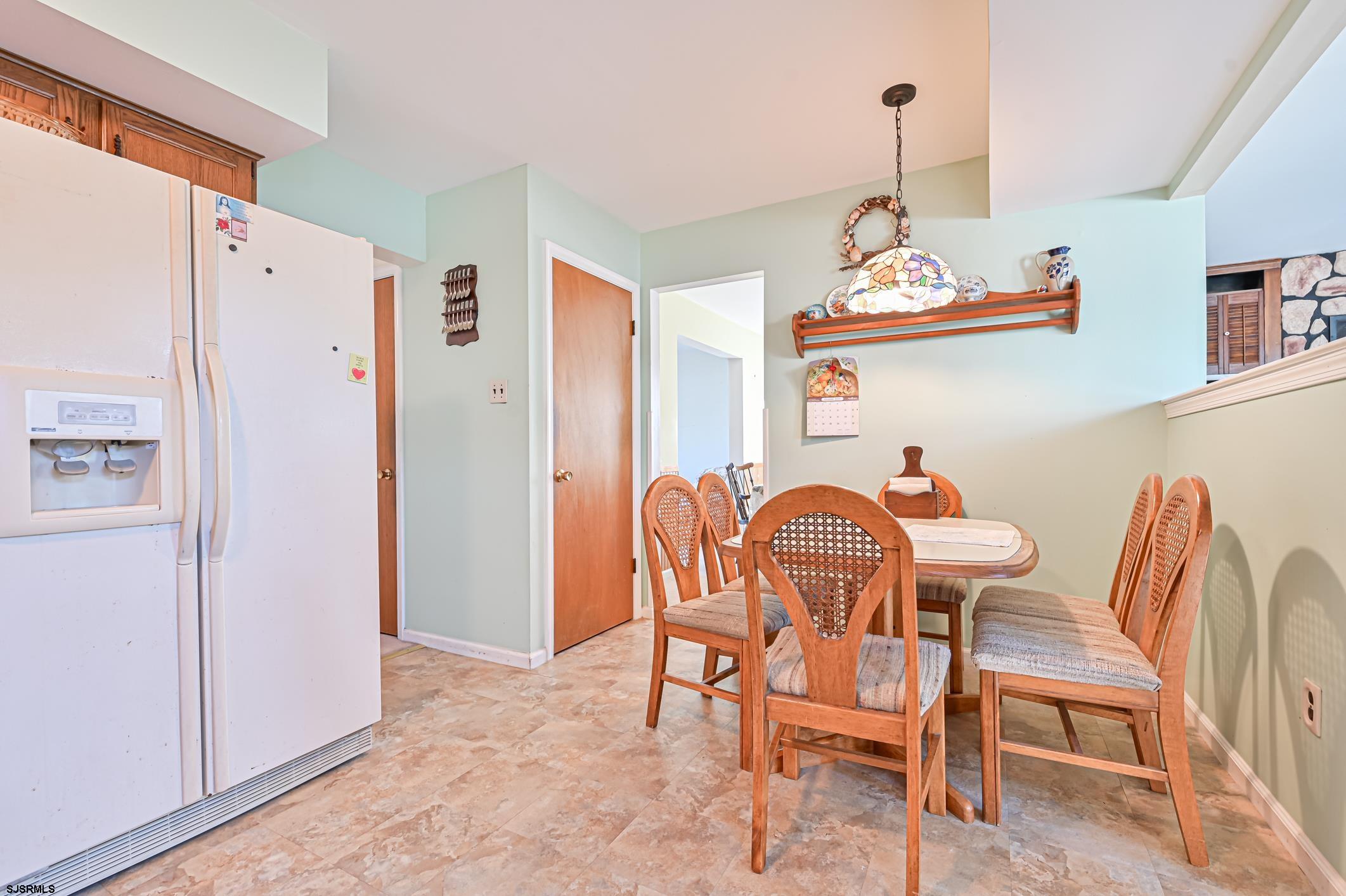 16 MacDermott Place Brigantine, NJ 08203 - Photo 12 of 37 a dining room with furniture and window