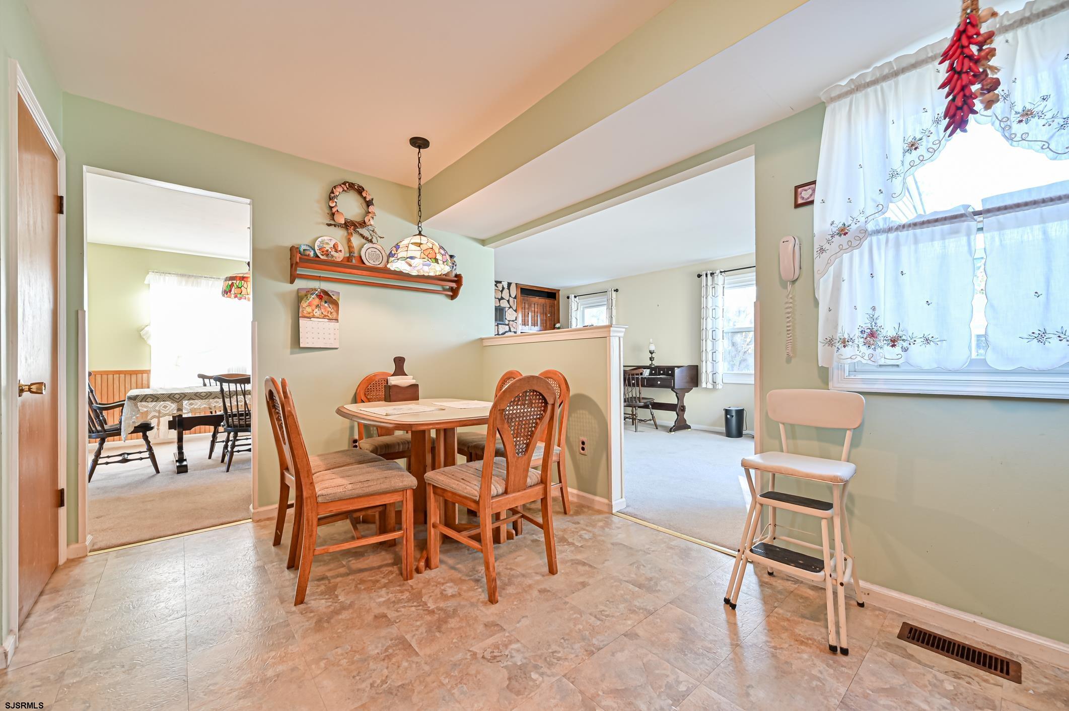 16 MacDermott Place Brigantine, NJ 08203 - Photo 14 of 37 a dining room with furniture and window