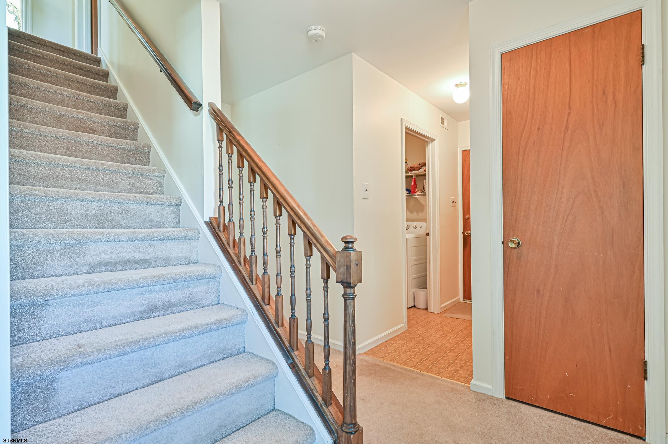 16 MacDermott Place Brigantine, NJ 08203 - Photo 19 of 37 a view of staircase with wooden floor and stairs