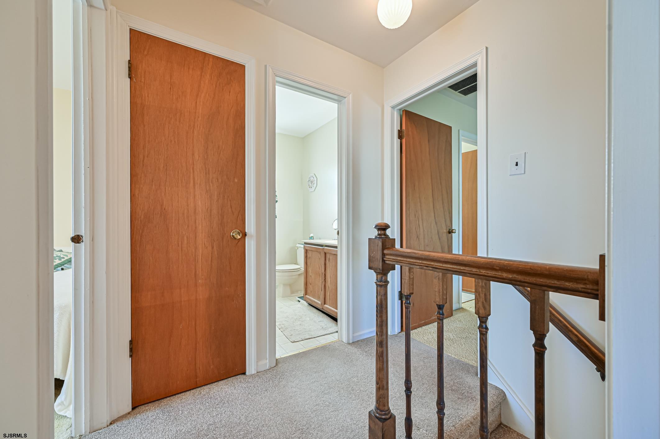 16 MacDermott Place Brigantine, NJ 08203 - Photo 21 of 37 a view of a hallway with wooden floor and entryway