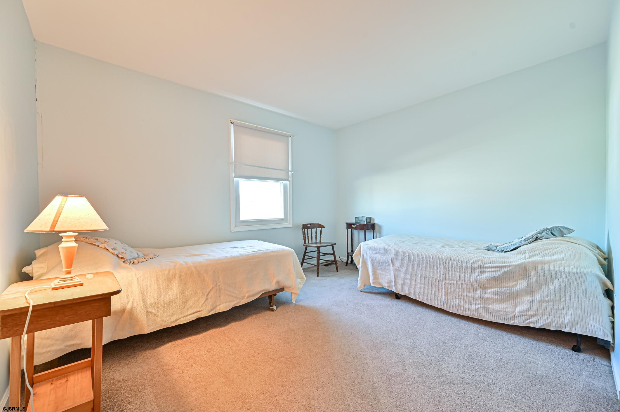 16 MacDermott Place Brigantine, NJ 08203 - Photo 23 of 37 a bedroom with a bed and window