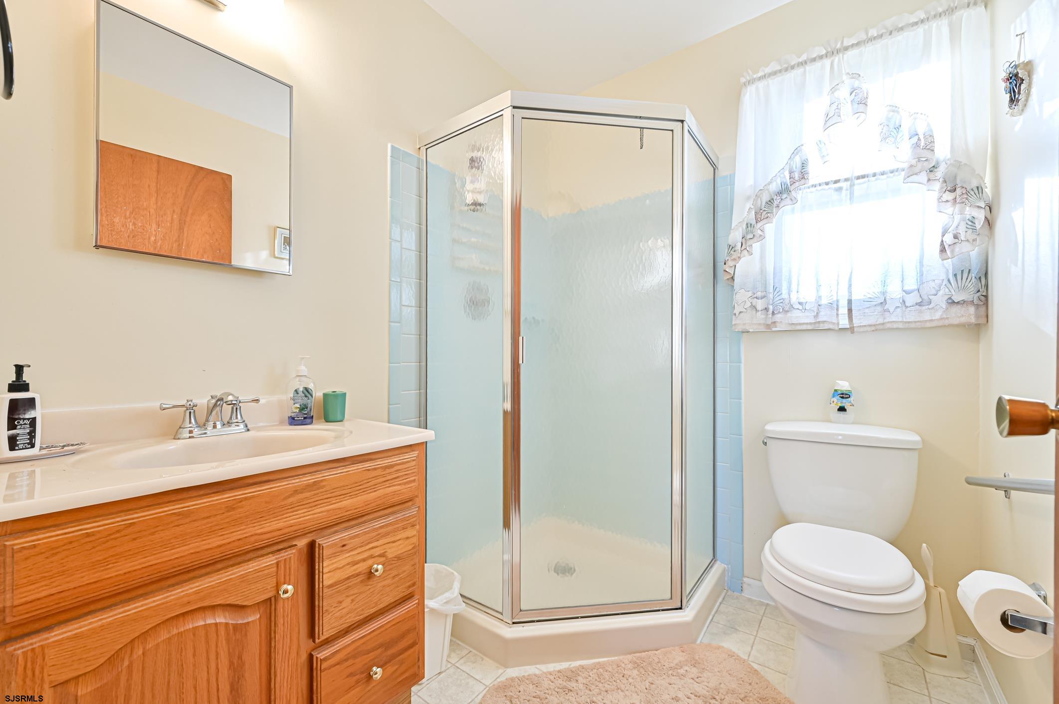 16 MacDermott Place Brigantine, NJ 08203 - Photo 26 of 37 a bathroom with a granite countertop sink toilet and shower