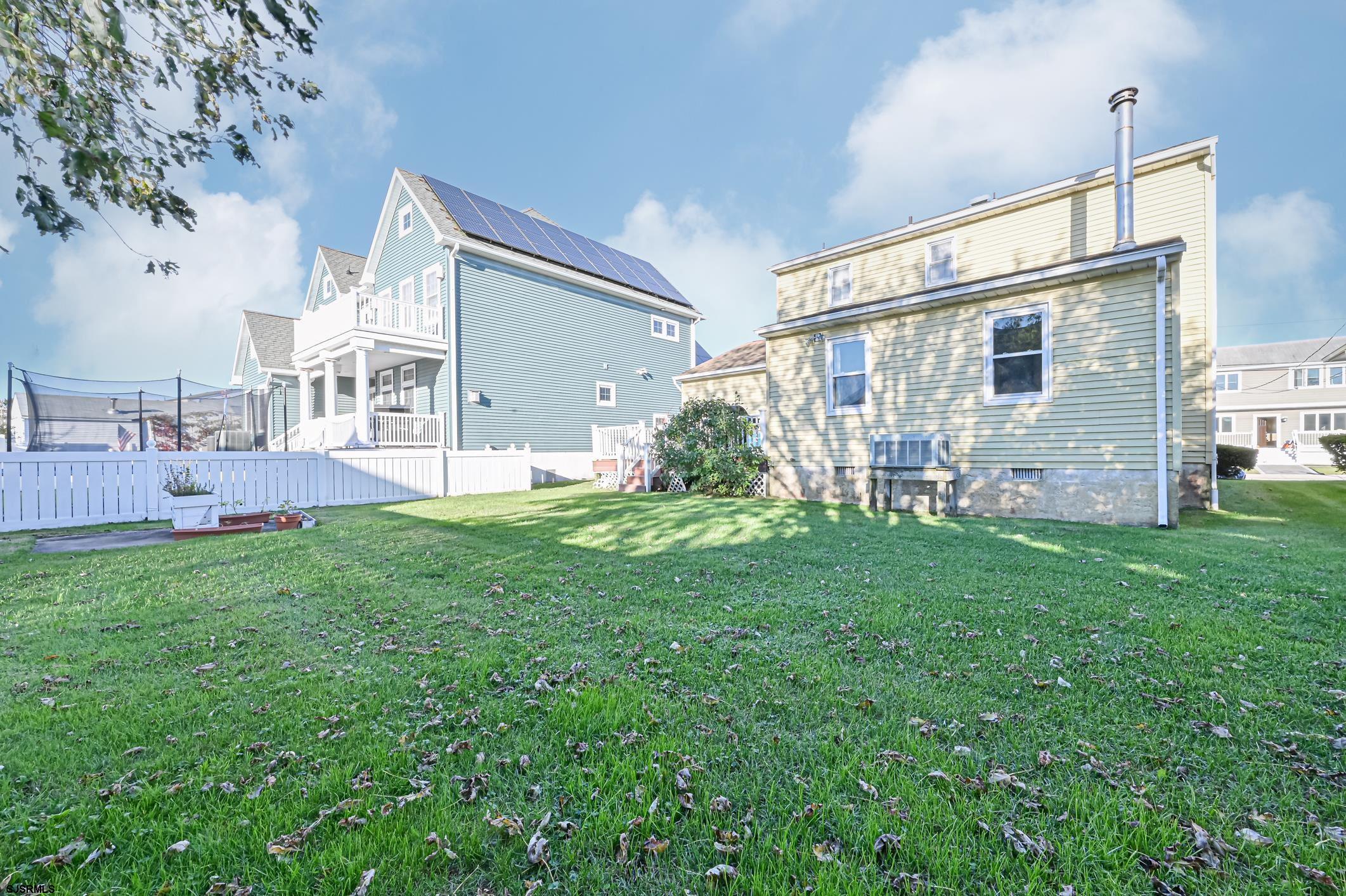 16 MacDermott Place Brigantine, NJ 08203 - Photo 30 of 37 a backyard of a house with table and chairs