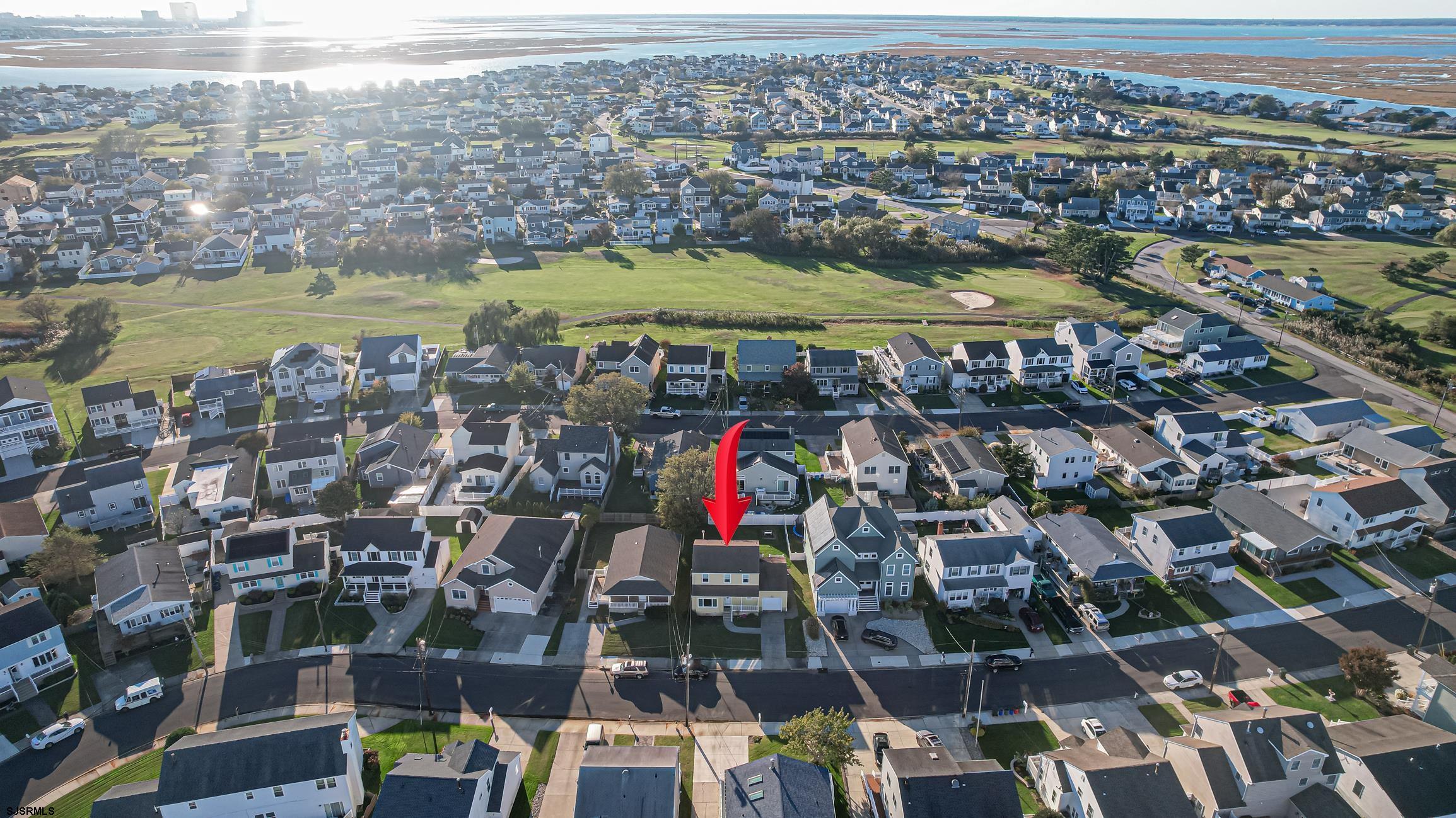 16 MacDermott Place Brigantine, NJ 08203 - Photo 3 of 37 an aerial view of residential building and lake