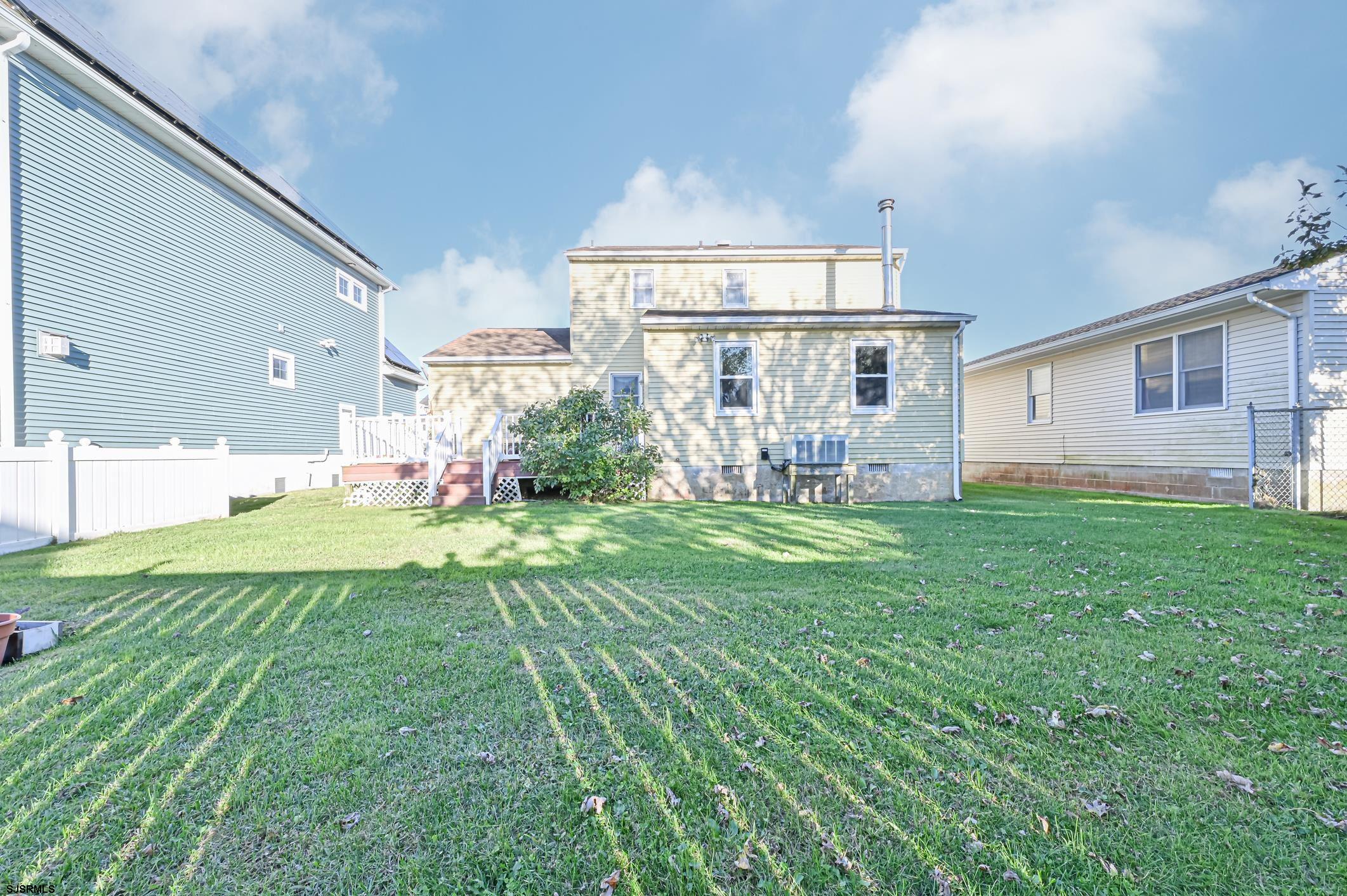 16 MacDermott Place Brigantine, NJ 08203 - Photo 32 of 37 a front view of a house with garden