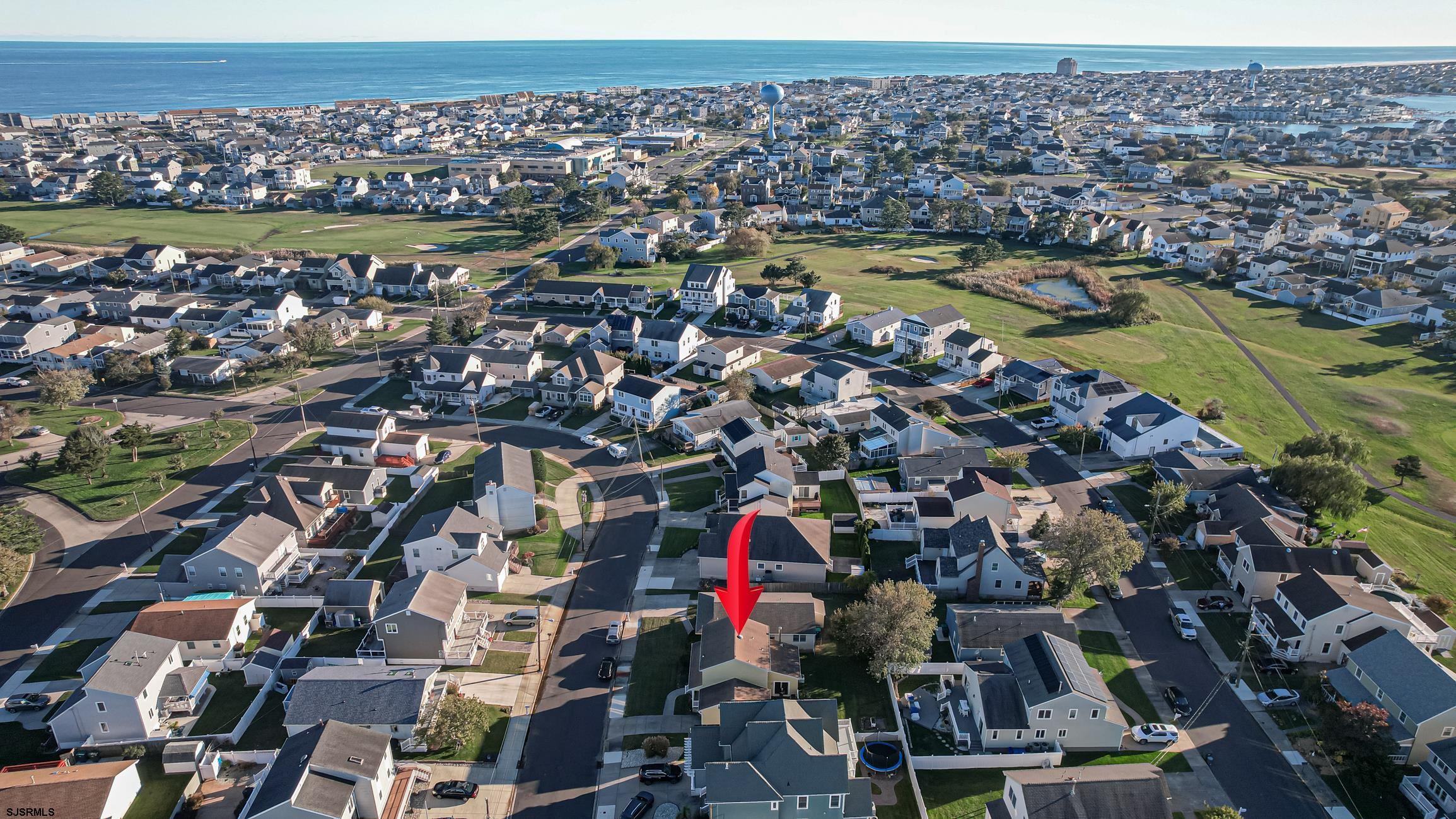16 MacDermott Place Brigantine, NJ 08203 - Photo 34 of 37 an aerial view of a houses with a lake view
