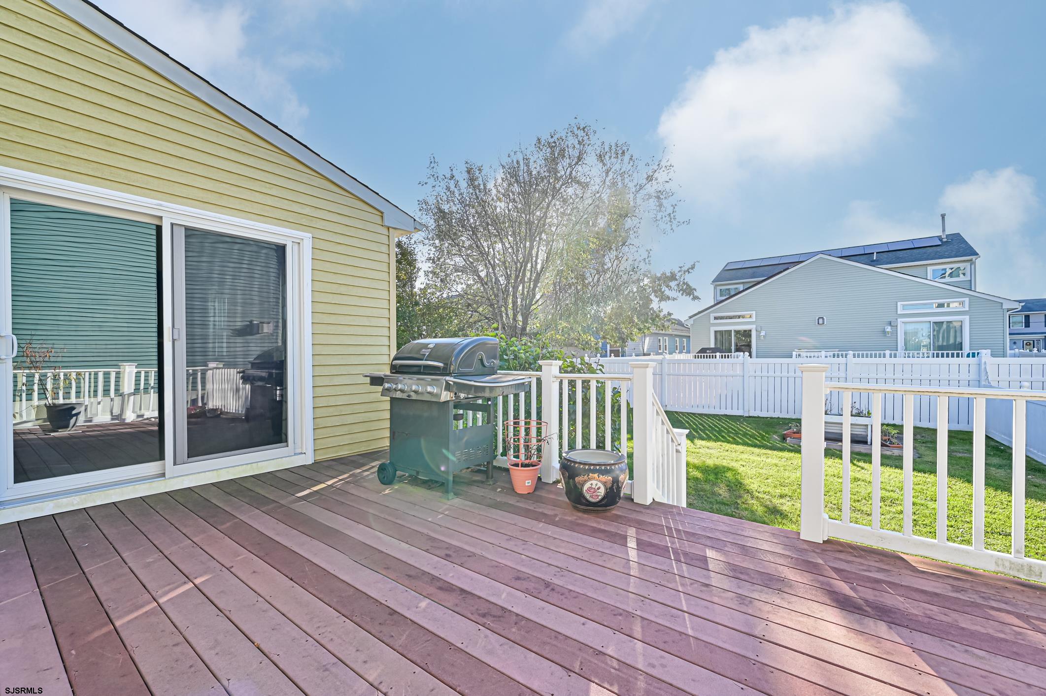 16 MacDermott Place Brigantine, NJ 08203 - Photo 37 of 37 a view of a deck with wooden floor and outer view