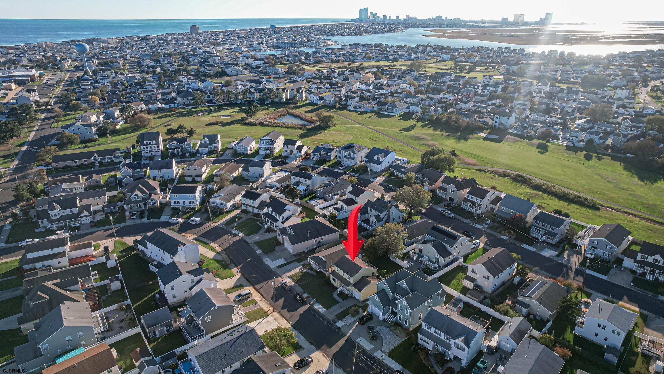 16 MacDermott Place Brigantine, NJ 08203 - Photo 5 of 37 an aerial view of residential houses with outdoor space