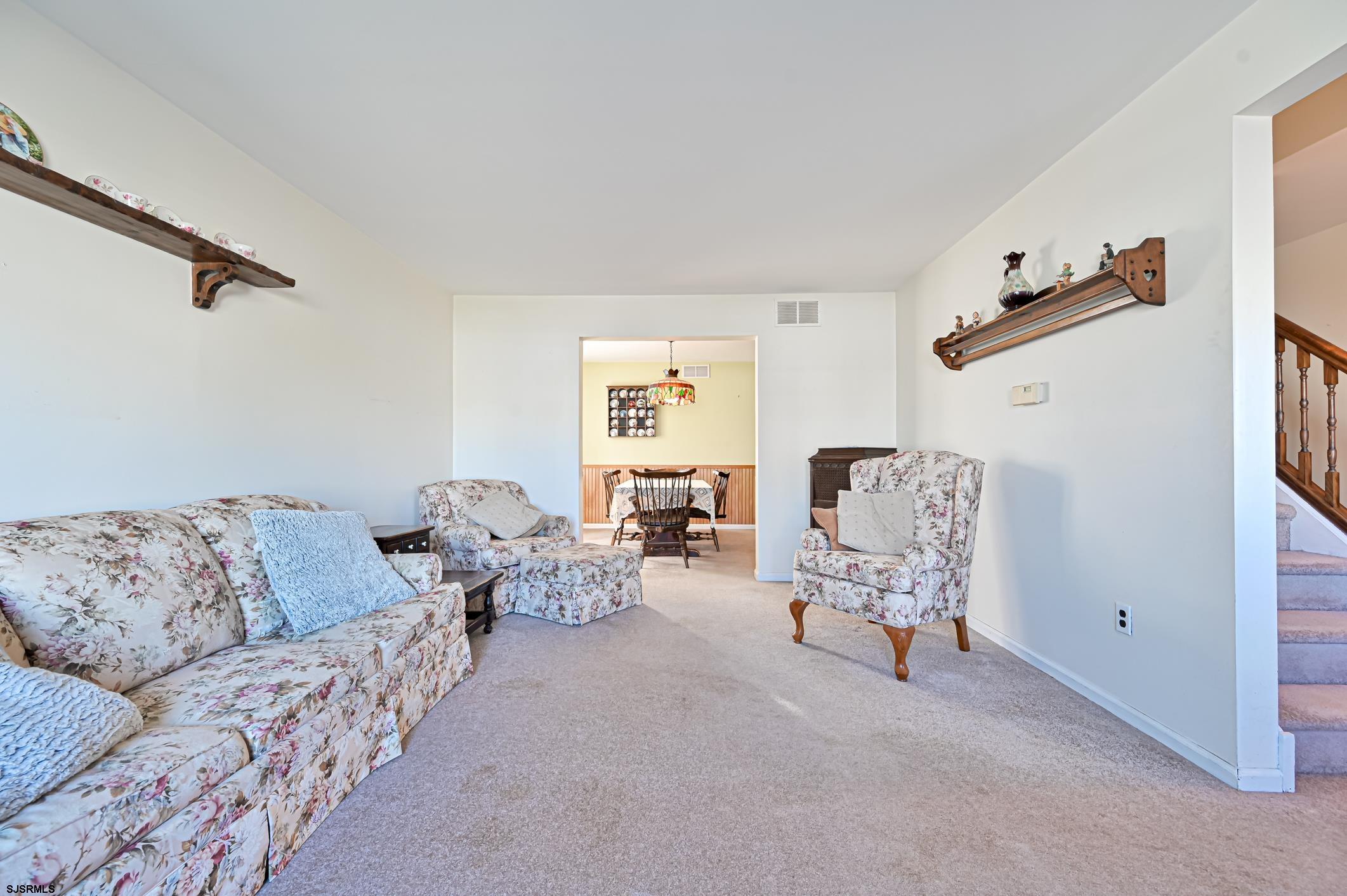 16 MacDermott Place Brigantine, NJ 08203 - Photo 6 of 37 a living room with furniture and a window